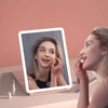 Foldable makeup mirror with lights and three-panel design for easy storage