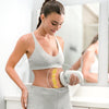 Handheld body massager featuring soft, washable massage pads