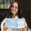 A woman with Phone PAP+ tooth whitening set from Diamond Smile