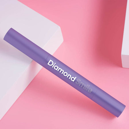 Diamond Smile purple colour-correcting tooth-whitening pen on a white background