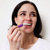 Woman with Diamond Smile purple colour-correcting whitening pen