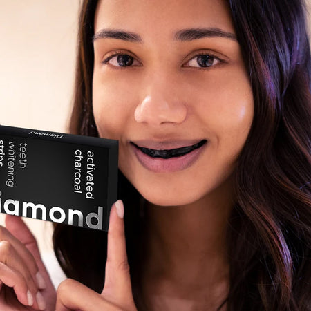 Diamond Smile activated charcoal tooth whitening strips for home whitening with white background