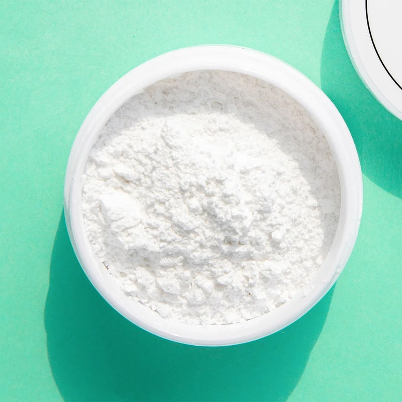 Diamond Smile PAP+ Teeth Whitening Powder in a test tube with a green background