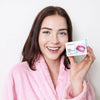 Woman holding Diamond Smile PAP+ Teeth Whitening Powder for brushing her teeth