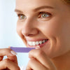 Mrs. Application of Diamond Smile tooth whitening strips for tooth whitening at home