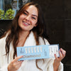 Woman with PAP+ tooth whitening gel from Diamond Smile