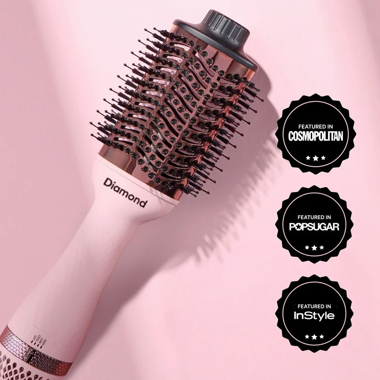 Volumising hot air styler with oval titanium brush design