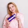 Woman with tooth whitening strips for whitening teeth at home