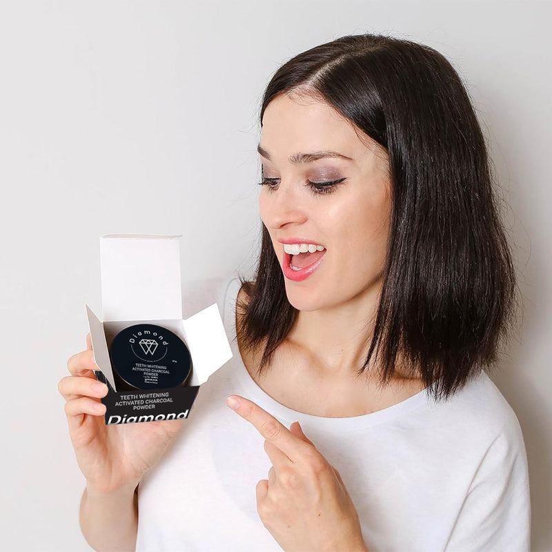 Woman with Diamond Smile tooth whitening activated charcoal powder Coco Powder