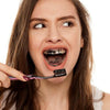 Whiten teeth with activated charcoal