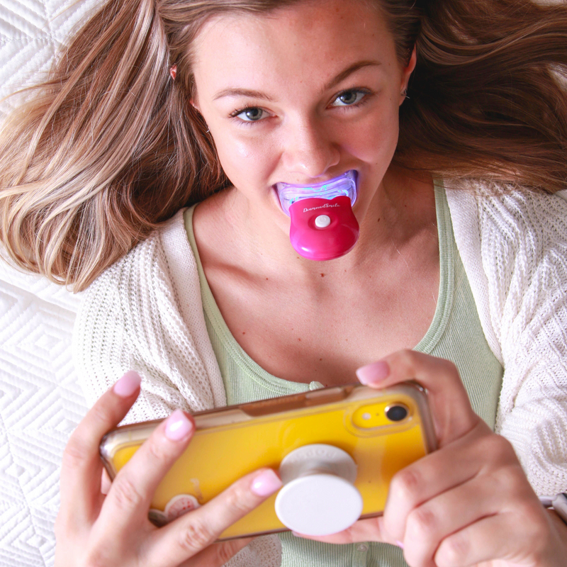 Diamond Smile tooth whitening experience - Woman with before and after picture of white teeth